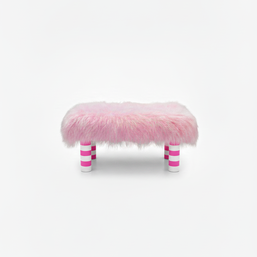 Handcrafted footstool with plush light pink shaggy faux fur top. It has wooden pink and white stripe legs. On a white background. Made by Little Forest Studio.