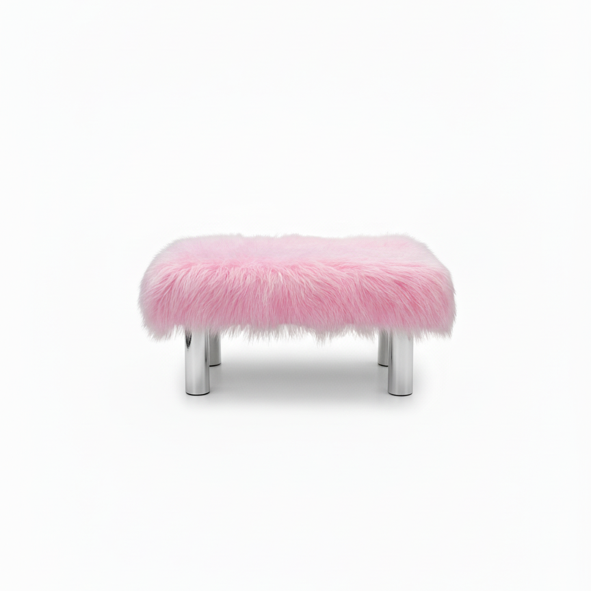Handcrafted footstool with plush light pink shaggy faux fur top. It has wooden silver legs. On a white background. Made by Little Forest Studio