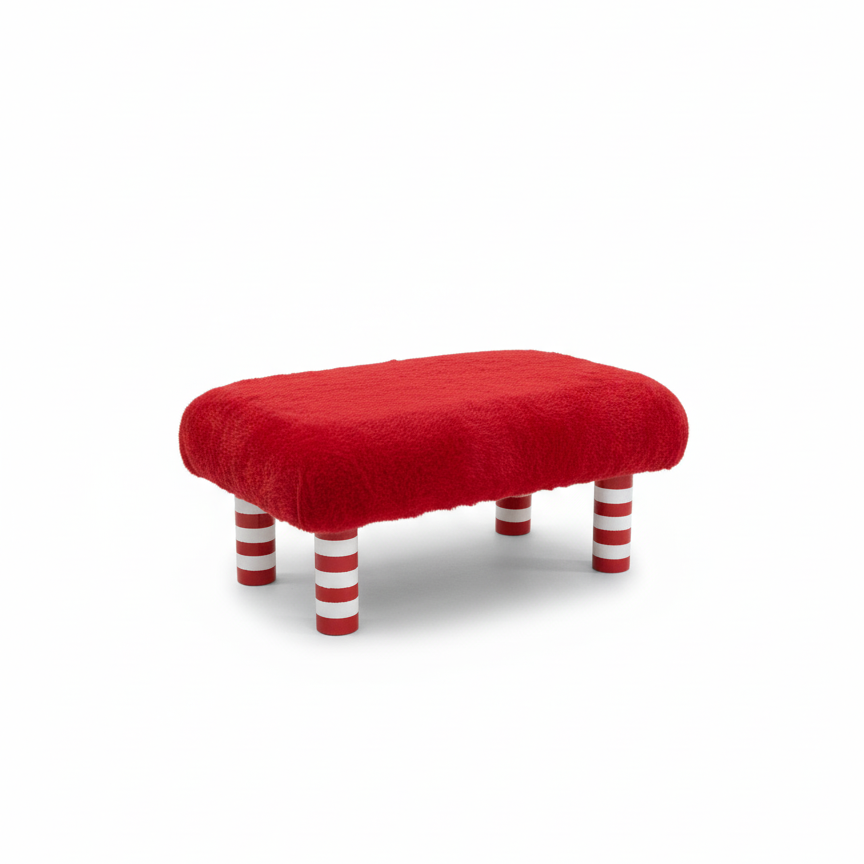 Handcrafted footstool with plush red faux fur top. It has wooden red and white candy cane stripe legs. On a white background. Made by Little Forest Studio.